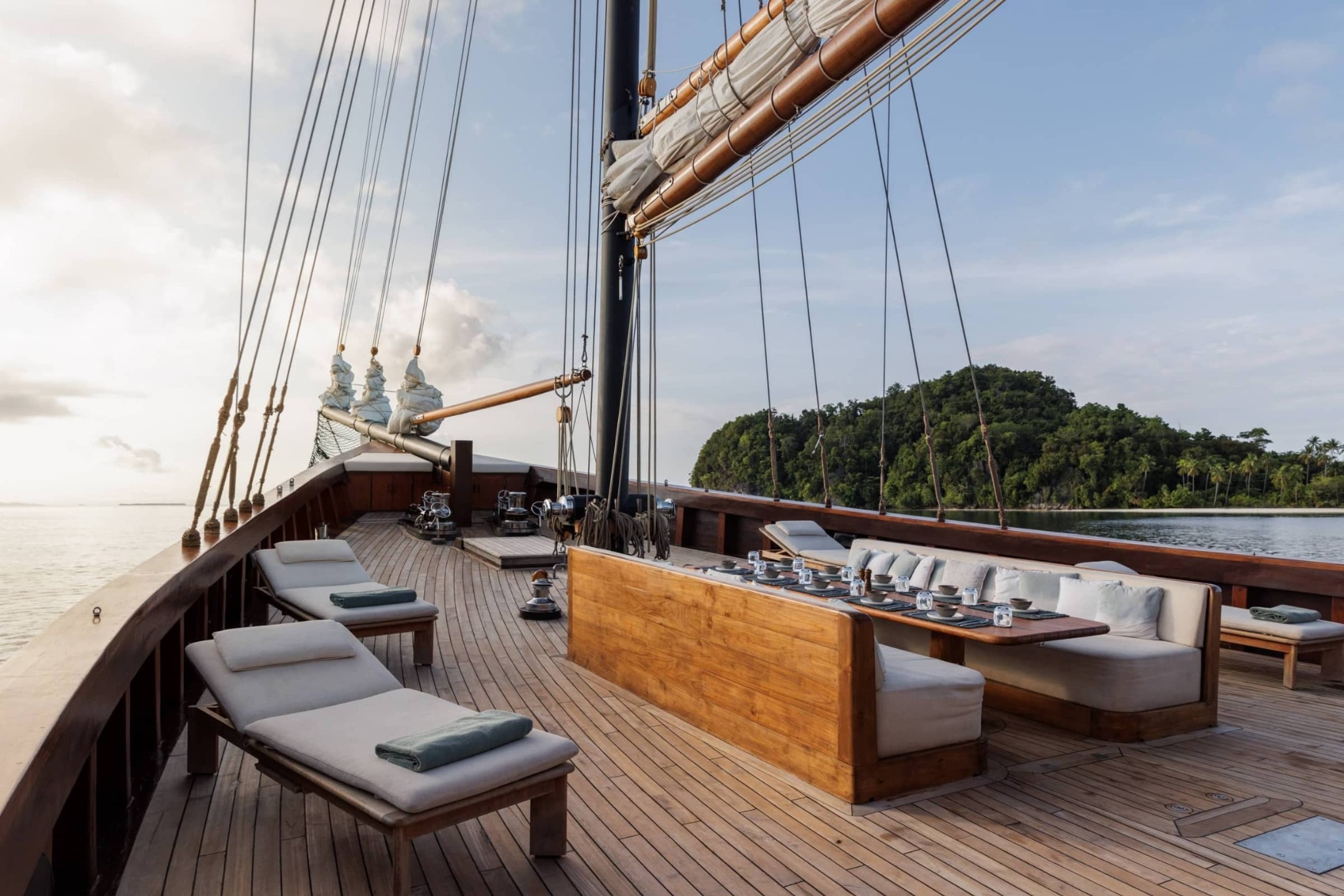 Vela traditional sailing yacht with white sails in Indonesia