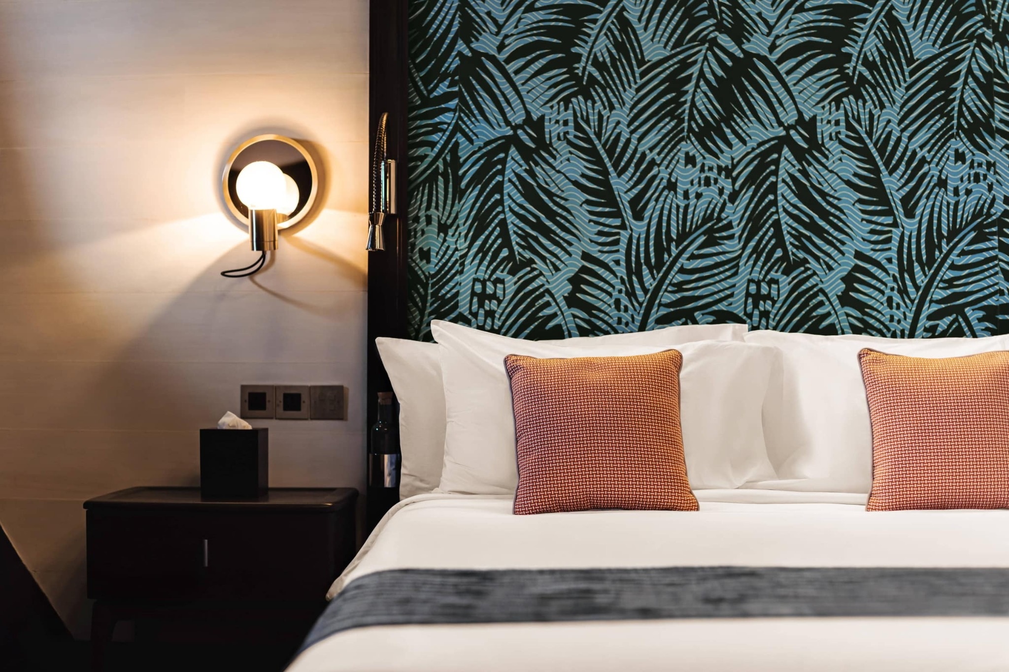 Vela Yacht General Stateroom with refined bedding and timber details